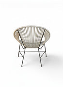 Paniery Signature Atlas Chair, handwoven light grey recycled fishing lines, modern sculptural design, black metal legs, indoor/outdoor use.