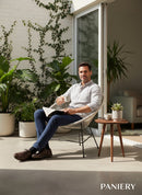 Paniery Signature Atlas Chair, handwoven white recycled fishing lines, modern sculptural design, suitable for indoor/outdoor use.