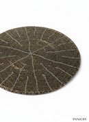 Paniery round beaded placemat with intricate radial pattern in bronze and silver threads. Handcrafted table art.