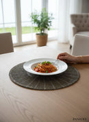 Paniery dark grey beaded placemat with sunburst pattern, handcrafted for elegant table settings.