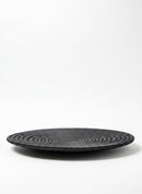 Paniery handwoven black raffia and sisal flat plate with concentric circle design, 30cm diameter.