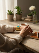 Paniery handmade brass cuff bracelet with a round teal blue stone accent. Recycled metal.