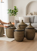Paniery luxury handwoven laundry basket in natural fibers with black leather trim, available in multiple sizes.