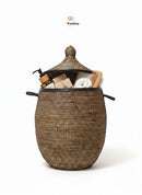 Paniery luxury handwoven laundry basket in natural fibers with full leather trim. Features handles and a domed lid. Perfect for storage or decor.