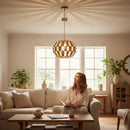 Paniery handwoven natural raffia pendant lampshade with geometric pattern, casting decorative light patterns on the ceiling.