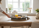 Paniery handwoven serving tray, 50 cm, with leather trim, holding breakfast items like pancakes and juice.