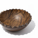 Paniery handcrafted dark brown olive wood serving bowl with unique wavy rim and natural grain patterns.