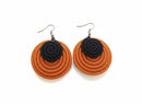 Paniery orange and black handwoven spiral statement earrings with hook closure.