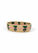 Paniery oval handwoven basket in natural fibers with green and pink geometric pattern. Versatile for serving, storage, or decor.