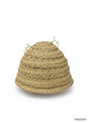 Paniery natural raffia lampshade, handwoven with a textured, layered design and delicate white floral accents.