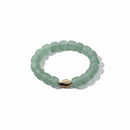 Paniery recycled seafoam green glass beaded bracelet with a small cowrie shell accent, unisex.