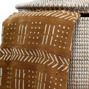 Paniery Senegal handwoven laundry basket with brown mud cloth pattern and white woven detail. Recycled plastic and leather.