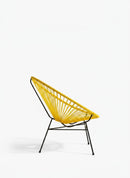 Paniery Signature Solis Chair in bright yellow, handwoven from recycled fishing lines with a black metal frame. Features a radial design.