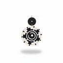 Paniery black and white handwoven spiral statement earrings with a circular design.