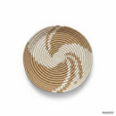 Paniery handwoven spiral woven tray in natural and white, featuring a concentric circular pattern and integrated hanging loop.
