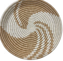 Paniery handwoven spiral woven tray in natural and white, featuring a concentric circular pattern and integrated hanging loop.