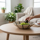 Paniery handwoven sweetgrass basket with black sunburst design, 50 cm diameter, holding grapes and an avocado.