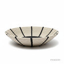 Paniery handwoven natural sweetgrass basket with bold black sunburst design, 50 cm diameter, for wall art or table decor.