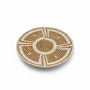 Paniery 40 cm round sweetgrass woven tray with a central spiral and geometric sunburst pattern in natural and white.