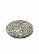 Paniery handwoven white natural fiber round coaster with a spiral pattern, perfect for table protection.
