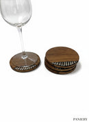 Paniery handcrafted wooden coasters with unique African-inspired black and white inlaid patterns. Set of 4.