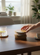 Paniery handcrafted wooden coasters with a minimalist natural design and decorative black and white pattern detail.