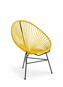 Paniery Signature Solis Chair in bright yellow, handwoven from recycled fishing lines with a black metal frame. Features a radial design.