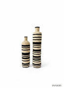 Paniery Zebra Harmony floor vases, handwoven natural fibers with black stripes. Tall statement decor.
