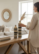 Paniery Zebra Harmony floor vase, handwoven from natural fibers with bold black and natural stripes. Tall statement piece.