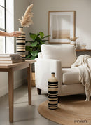 Paniery handwoven African floor vase with black and natural stripes, made from natural fibers. Ideal for statement decor.